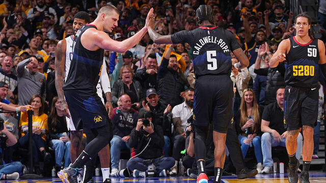 DENVER, CO - NOVEMBER 14: Nikola Jokic #15 and Kentavious Caldwell-Pope #5 of the Denver Nuggets high five during the game against the LA Clippers during the In-Season Tournament game on November 14, 2023 at the Ball Arena in Denver, Colorado. NOTE TO USER: User expressly acknowledges and agrees that, by downloading and/or using this Photograph, user is consenting to the terms and conditions of the Getty Images License Agreement. Mandatory Copyright Notice: Copyright 2023 NBAE