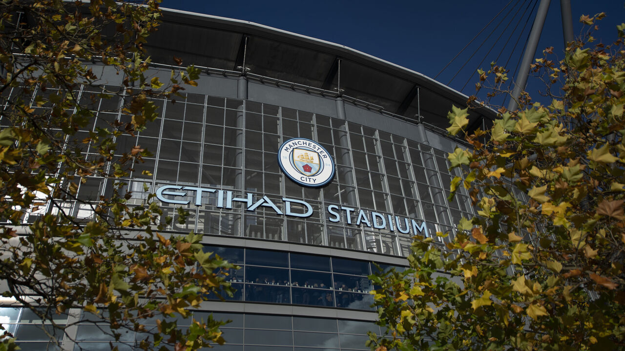 MANCHESTER, ENGLAND - OCTOBER 30: A general view of the Etihad Stadium logo with the Manchester City club crest between autumn leaves before the Premier League match between Manchester City and Crystal Palace at Etihad Stadium on October 30, 2021 in Manchester, England.