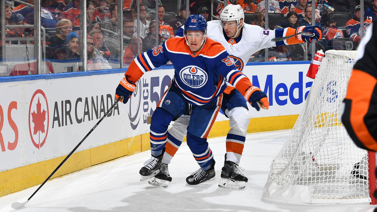 EDMONTON, CANADA - NOVEMBER 13: Dylan Holloway #55 of the Edmonton Oilers skates during the game against Scott Mayfield #24 of the New York Islanders at Rogers Place on November 13, 2023, in Edmonton, Alberta, Canada.
