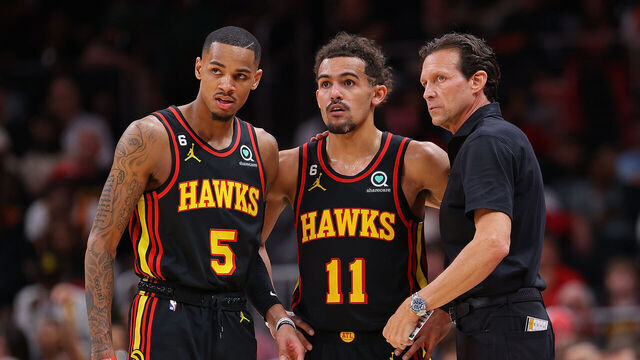 ATLANTA, GEORGIA - APRIL 21: Head coach Quin Snyder of the Atlanta Hawks converses with Trae Young #11 and Dejounte Murray #5 against the Boston Celtics during the fourth quarter of Game Three of the Eastern Conference First Round Playoffs at State Farm Arena on April 21, 2023 in Atlanta, Georgia.