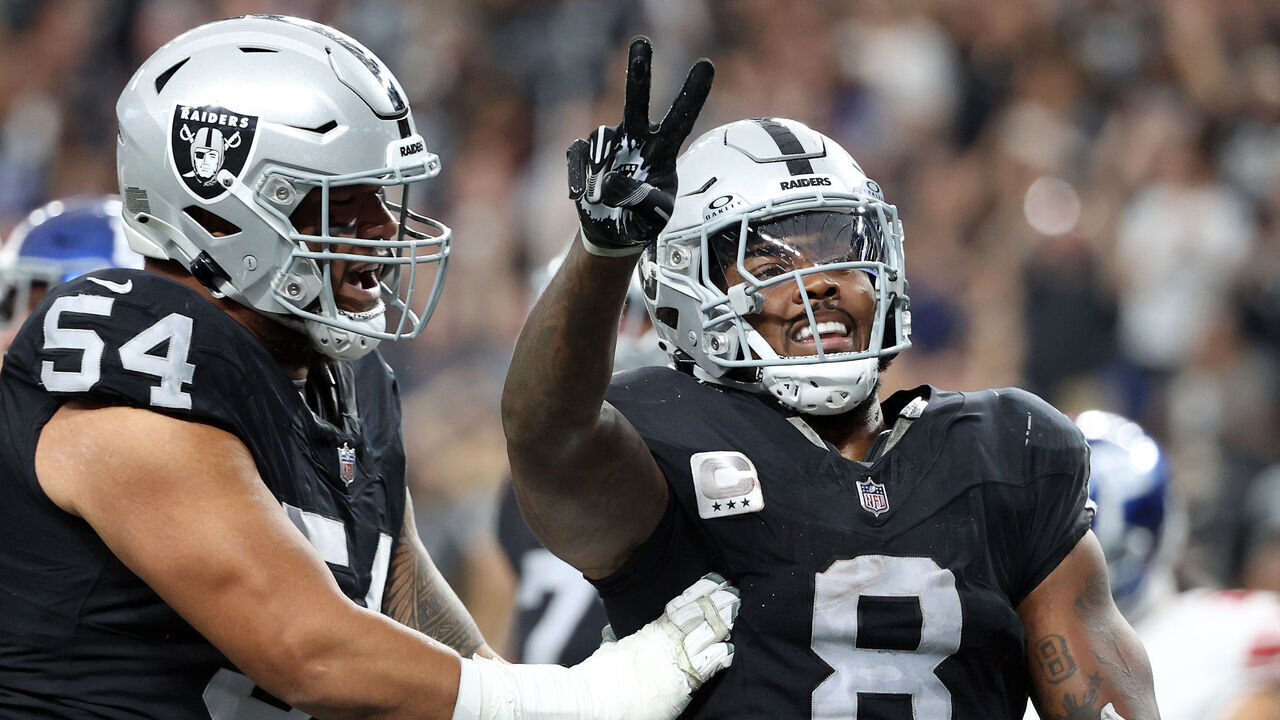 LAS VEGAS, NEVADA - NOVEMBER 05: Josh Jacobs #8 of the Las Vegas Raiders celebrates with Netane Muti #54 after a touchdown in the second quarter of a game against the New York Giants at Allegiant Stadium on November 05, 2023 in Las Vegas, Nevada.