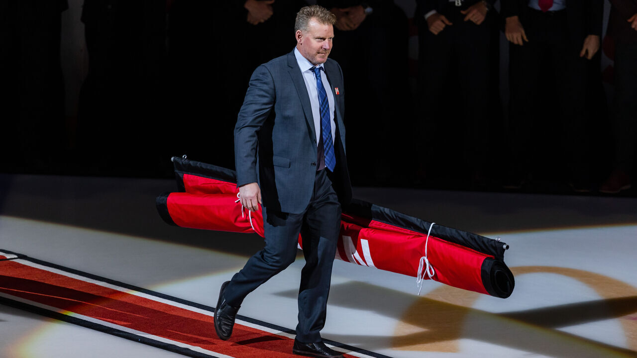 OTTAWA, ON - FEBRUARY 17: Former Ottawa Senators Daniel Alfredsson carries out the banner during Chris Neil's Jersey Retirement Ceremony before National Hockey League action between the Chicago Blackhawks and Ottawa Senators on February 17, 2023, at Canadian Tire Centre in Ottawa, ON, Canada.