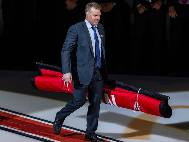 OTTAWA, ON - FEBRUARY 17: Former Ottawa Senators Daniel Alfredsson carries out the banner during Chris Neil's Jersey Retirement Ceremony before National Hockey League action between the Chicago Blackhawks and Ottawa Senators on February 17, 2023, at Canadian Tire Centre in Ottawa, ON, Canada.
