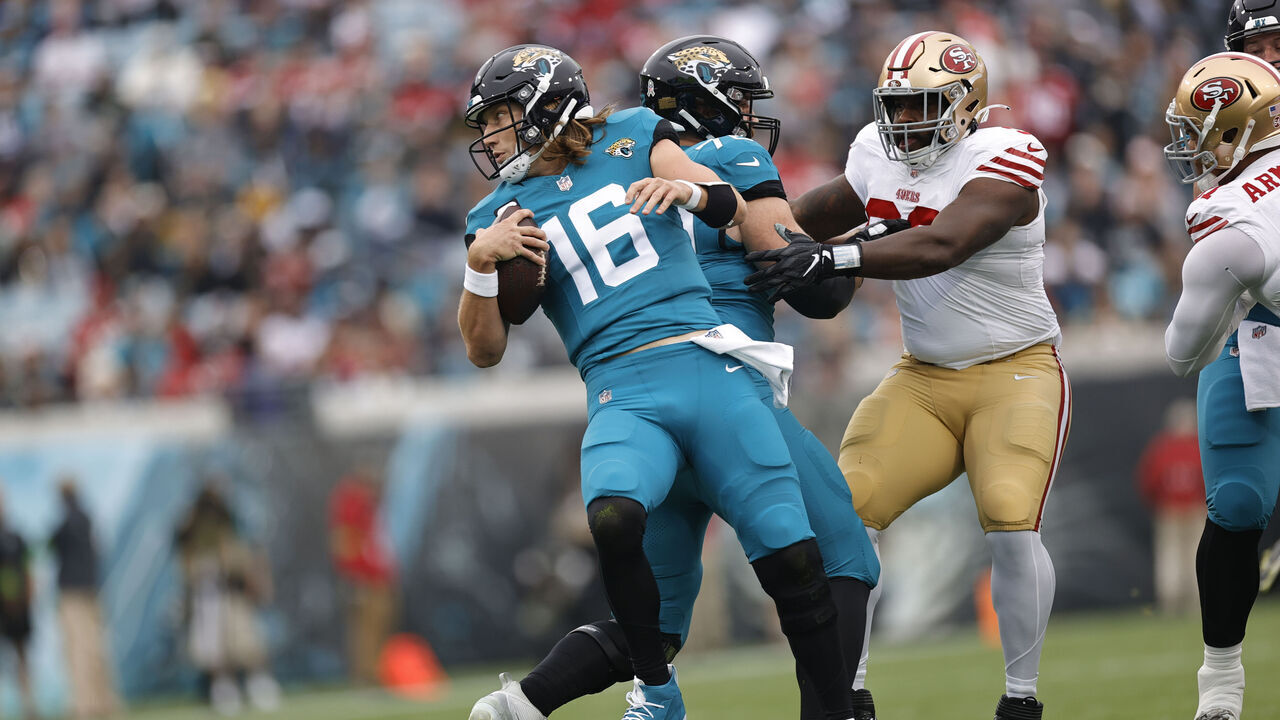 JACKSONVILLE, FL - NOVEMBER 12: Trevor Lawrence #16 of the Jacksonville Jaguars trips over his teammate during the game against the San Francisco 49ers at EverBank Stadium on November 12, 2023 in Jacksonville, Florida. The 49ers defeated the Jaguars 34-3.