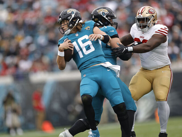 JACKSONVILLE, FL - NOVEMBER 12: Trevor Lawrence #16 of the Jacksonville Jaguars trips over his teammate during the game against the San Francisco 49ers at EverBank Stadium on November 12, 2023 in Jacksonville, Florida. The 49ers defeated the Jaguars 34-3.
