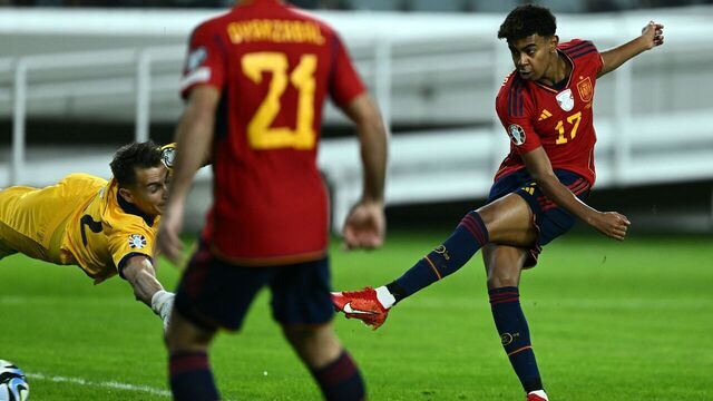 Spain's forward #17 Lamine Yamal (R) shoots to score his team's first goal during the UEFA Euro 2024 Group A qualifying football match between Cyprus and Spain at the Alphamega Stadium in Limassol on November 16, 2023.