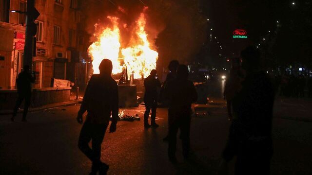 Protesters burn vehicles outside the Vassil Levski Stadium during the UEFA Euro 2024 Group G qualification football match between Bulgaria and Hungary, at the Vassil Levski Stadium in Sofia, on November 16, 2023. At least five policemen and ten football fans were injured in clashes outside the stadium during Bulgaria's Euro 2024 qualifier against Hungary which ended in a 2-2 draw on Thursday, police said. Over 2,000 supporters gathered outside the national stadium shouting "Resign!" and holding banners "18 years is enough" to call for the resignation of long-time BFU president Borislav Mihaylov.