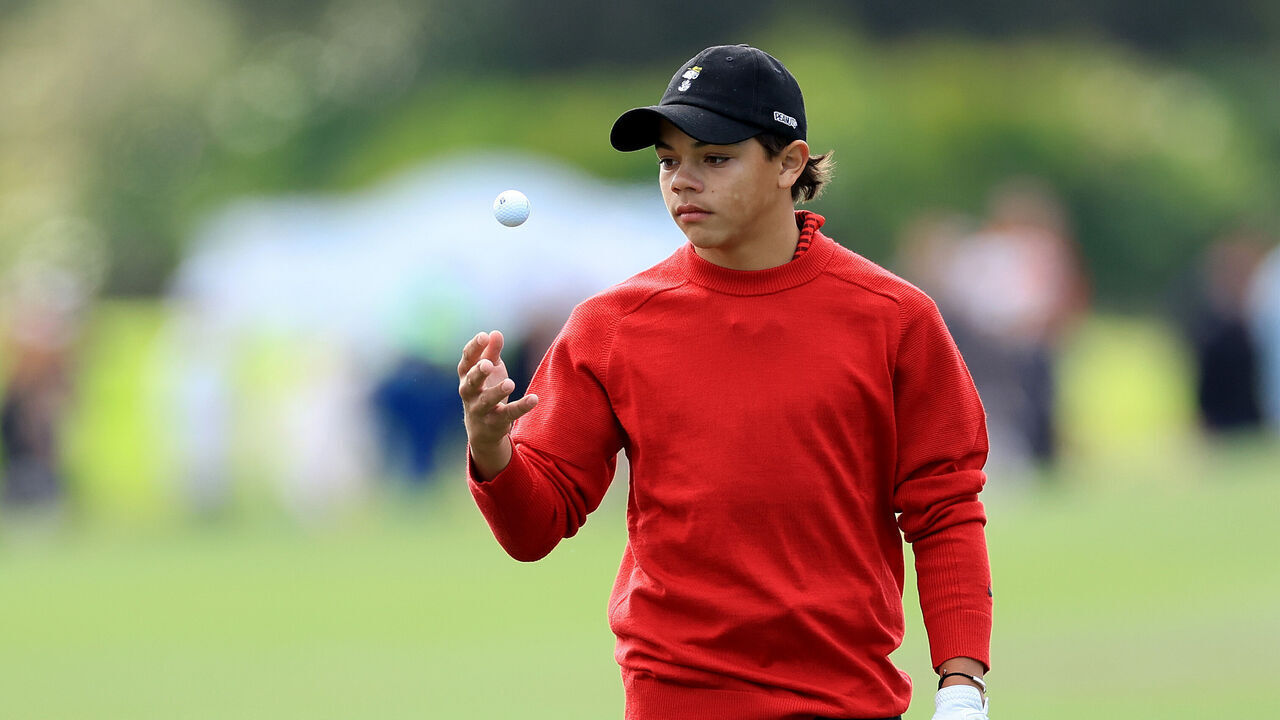 ORLANDO, FLORIDA - DECEMBER 18: Charlie Woods the son of Tiger Woods of The United States tosses his golf ball whilst waiting to play his second shot on the third hole during the final round of the 2022 PNC Championship at The Ritz-Carlton Golf Club on December 18, 2022 in Orlando, Florida.