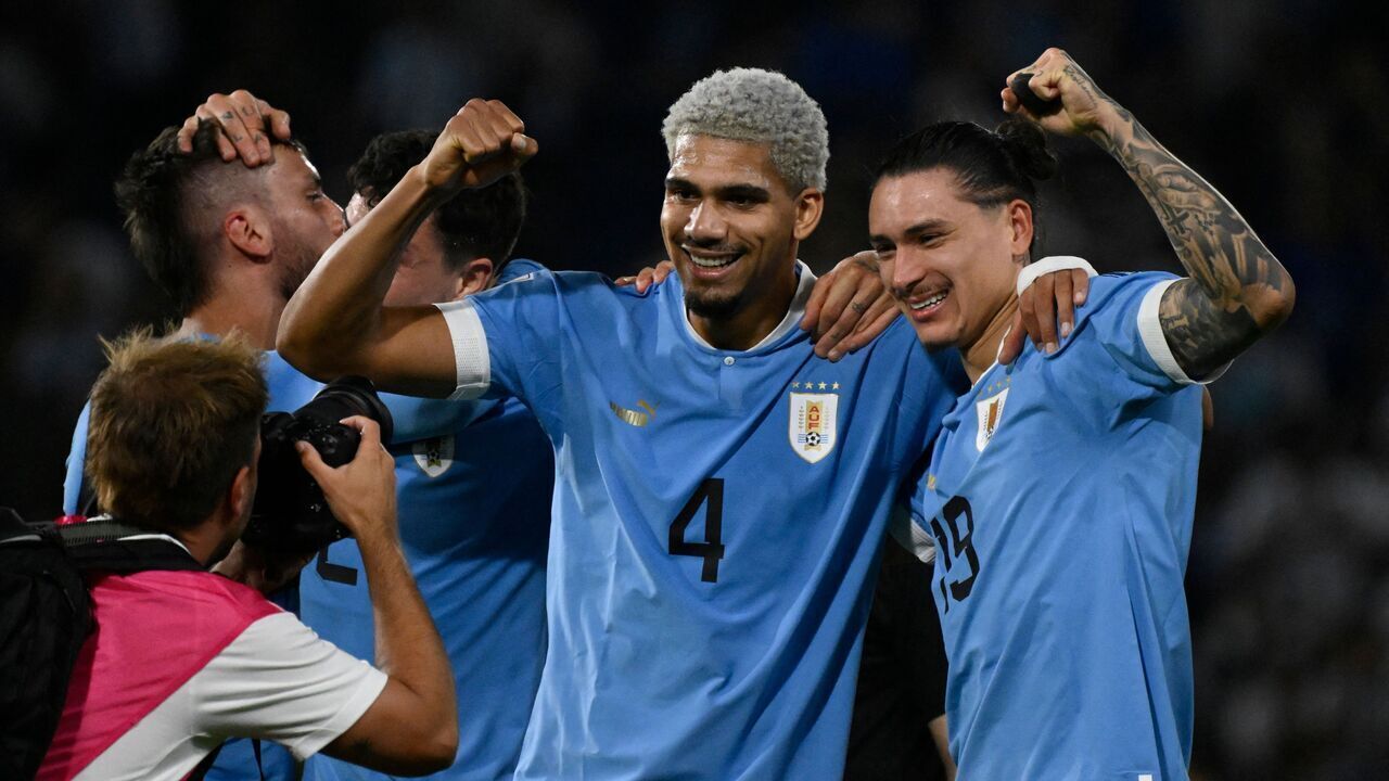 Uruguay's defender Ronald Araujo (L) and forward Darwin Nunez (R), the players who scored for Uruguay to defeat Argentina, pose for a picture after the end of the 2026 FIFA World Cup South American qualification football match between Argentina and Uruguay at La Bombonera stadium in Buenos Aires on November 16, 2023.