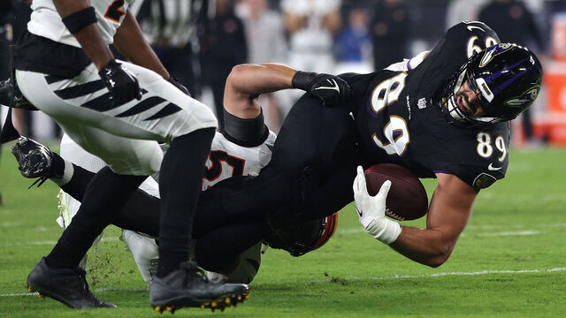 BALTIMORE, MARYLAND - NOVEMBER 16: Mark Andrews #89 of the Baltimore Ravens is tackled by Logan Wilson #55 of the Cincinnati Bengals during the first quarter of the game at M&T Bank Stadium on November 16, 2023 in Baltimore, Maryland.