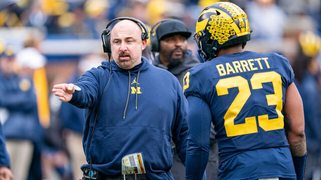 ANN ARBOR, MI - APRIL 01: Linebackers Coach Chris Partridge speaks with Michael Barrett #23 of the Blue Team during the second quarter of the Michigan Football spring game at Michigan Stadium on April 1, 2023 in Ann Arbor, Michigan.