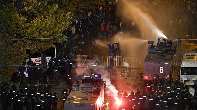Police uses a water cannon towards protesters outside the Vassil Levski Stadium ahead of the UEFA Euro 2024 Group G qualification football match between Bulgaria and Hungary, at the Vassil Levski Stadium in Sofia, on November 16, 2023. At least five policemen and ten football fans were injured in clashes outside the stadium during Bulgaria's Euro 2024 qualifier against Hungary which ended in a 2-2 draw on Thursday, police said. Over 2,000 supporters gathered outside the national stadium shouting "Resign!" and holding banners "18 years is enough" to call for the resignation of long-time BFU president Borislav Mihaylov.