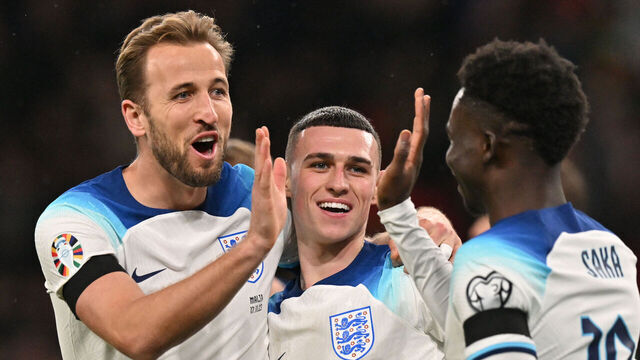 England's striker #09 Harry Kane (L) celebrates with teammates after scoring his team second goal during the UEFA Euro 2024 Group C qualifying football match between England and Malta, at Wembley stadium, in north London, on November 17, 2023.