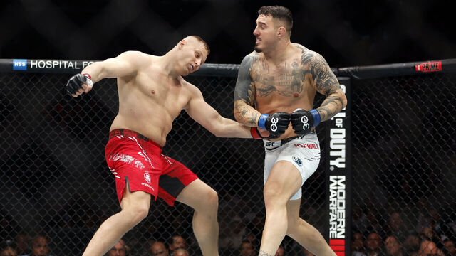 NEW YORK, NEW YORK - NOVEMBER 11: (R-L) Tom Aspinall of England knocks out Sergei Pavlovich of Russia in the interim UFC heavyweight championship fight during the UFC 295 event at Madison Square Garden on November 11, 2023 in New York City.
