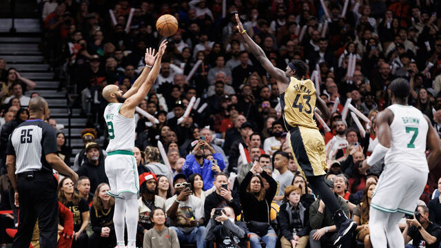 TORONTO, CANADA - NOVEMBER 17: Derrick White #9 of the Boston Celtics puts up a shot over Pascal Siakam #43 of the Toronto Raptors during the second half of their NBA In-Season Tournament game at Scotiabank Arena on November 17, 2023 in Toronto, Canada.