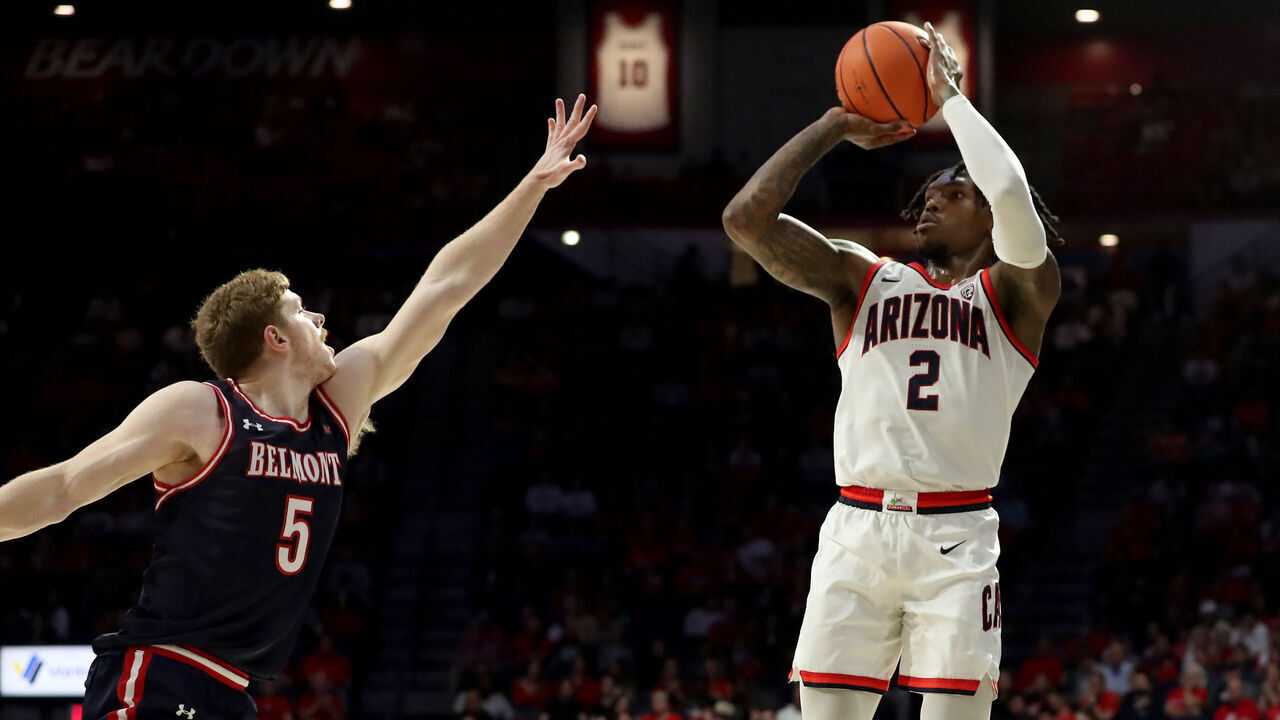 TUCSON, AZ - NOVEMBER 17: Arizona Wildcats guard Caleb Love #2 shoots the ball over Belmont Bruins guard Jayce Willingham #5 during the first half of a men's basketball game between the Belmont Bruins and the University of Arizona Wildcats on November 17, 2023 at McKale Center in Tucson, AZ.