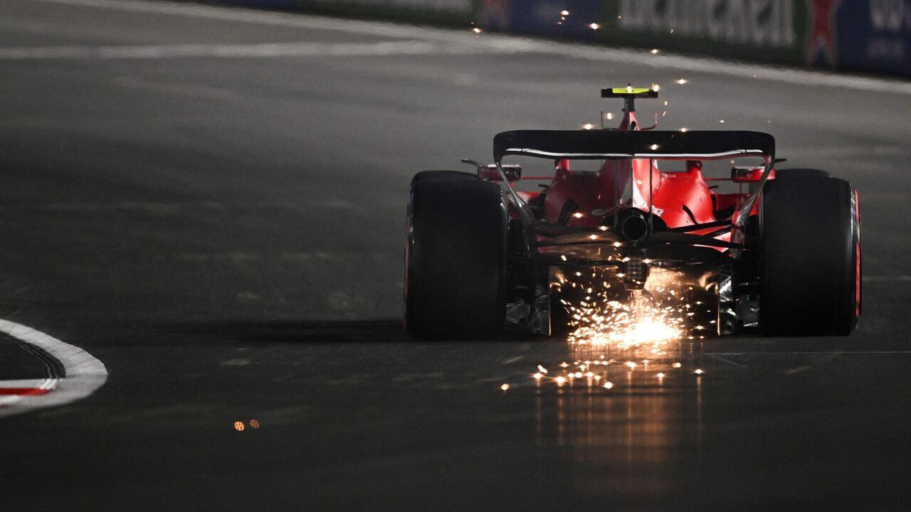 Sparks fly from the car of Ferrari's Spanish driver Carlos Sainz Jr. as he races during the qualifying session for the Las Vegas Formula One Grand Prix on November 18, 2023, in Las Vegas, Nevada.