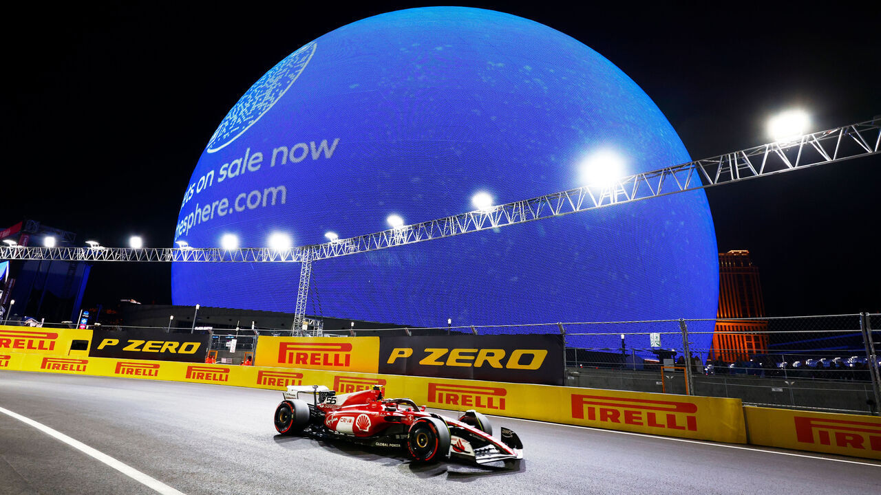 LAS VEGAS, NV - NOVEMBER 18: Ferrari driver Carlos Sainz (55) of Spain races past the Sphere during qualifying for the Formula 1 Heineken Silver Las Vegas Gran Prix on November 18, 2023 on the Las Vegas Street Circuit in Las Vegas, Nevada.