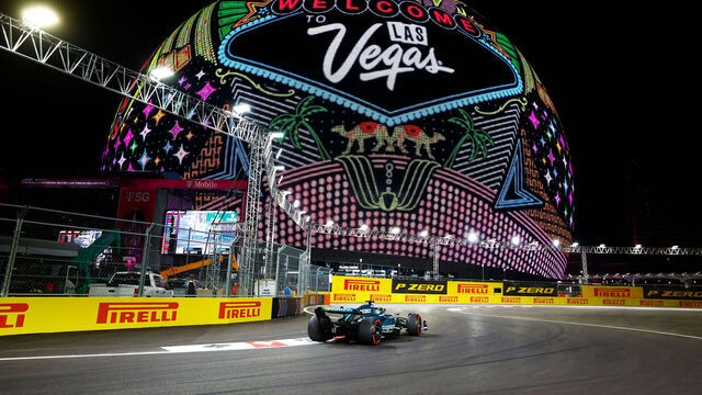 LAS VEGAS, NV - NOVEMBER 18: Aston Martin Racing driver Lance Stroll (18) of Canada races in front of the Sphere with "Welcome to Las Vegas" art displayed during qualifying for the Formula 1 Heineken Silver Las Vegas Gran Prix on November 18, 2023 on the Las Vegas Street Circuit in Las Vegas, Nevada.
