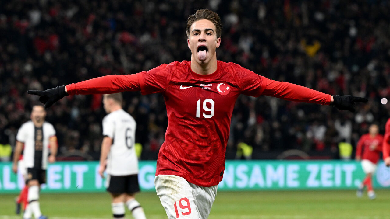 dpatop - 18 November 2023, Berlin: Soccer: International match, Germany - Turkey, Olympiastadion. Kenan Yildiz of Turkey celebrates his goal to make it 1-2. IMPORTANT NOTE: In accordance with the regulations of the DFL German Football League and the DFB German Football Association, it is prohibited to use or have used photographs taken in the stadium and/or of the match in the form of sequential images and/or video-like photo series. Photo: Federico Gambarini/dpa