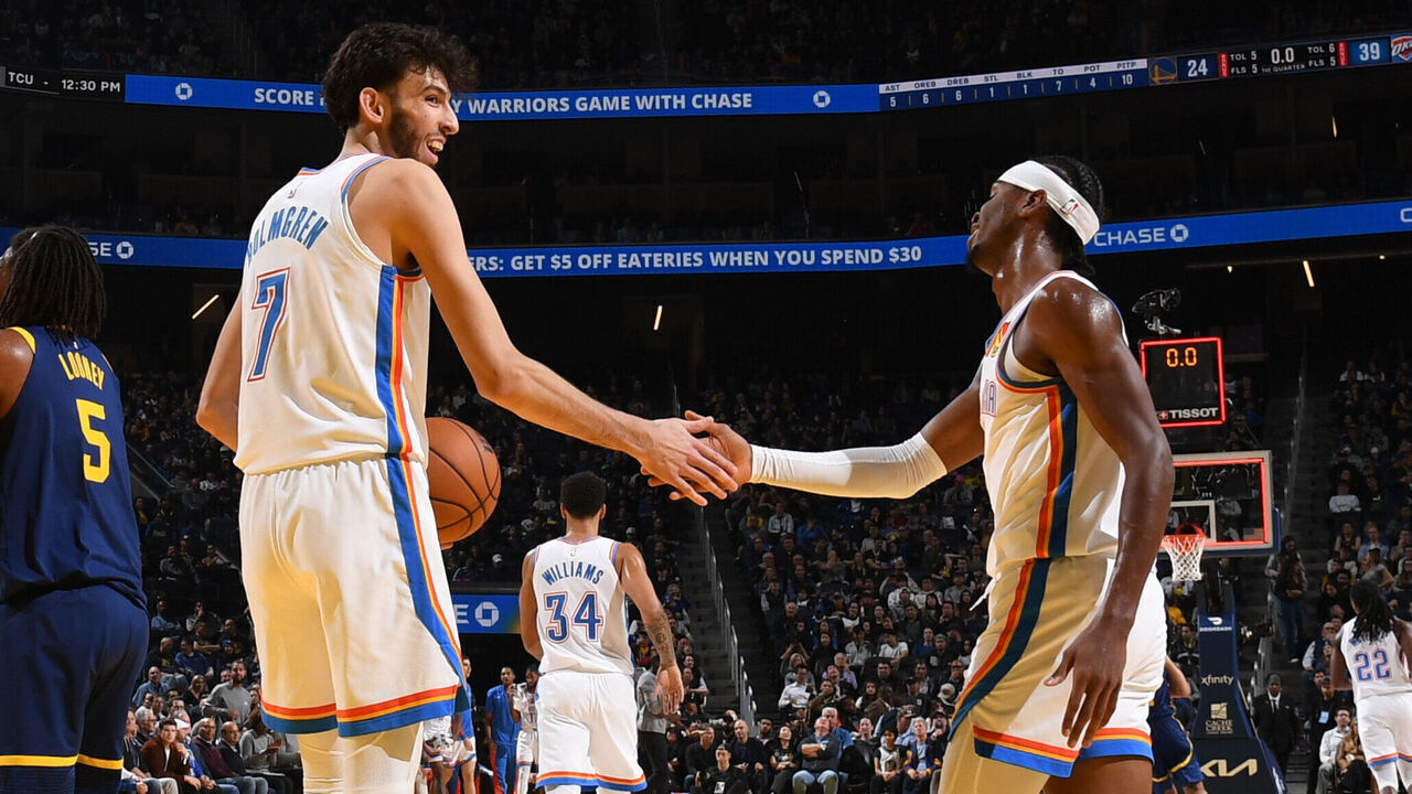 SAN FRANCISCO, CA - NOVEMBER 16: Chet Holmgren #7 and Shai Gilgeous-Alexander #2 of the Oklahoma City Thunder high five during the game against the Golden State Warriors on November 16, 2023 at Chase Center in San Francisco, California. NOTE TO USER: User expressly acknowledges and agrees that, by downloading and or using this photograph, user is consenting to the terms and conditions of Getty Images License Agreement. Mandatory Copyright Notice: Copyright 2023 NBAE
