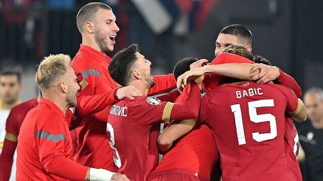 Serbia's players celebrate after they qualified for the Euro 2024 at the end of the UEFA Champions League Qualifying Group G football match between Serbia and Bulgaria at Gradski Dubocica stadium in Leskovac, Serbia on November 19, 2023. The match ended 2-2.