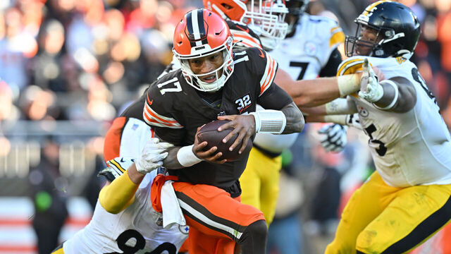 CLEVELAND, OHIO - NOVEMBER 19: Dorian Thompson-Robinson #17 of the Cleveland Browns runs with the ball while being tackled by T.J. Watt #90 of the Pittsburgh Steelers in the fourth quarter at Cleveland Browns Stadium on November 19, 2023 in Cleveland, Ohio.