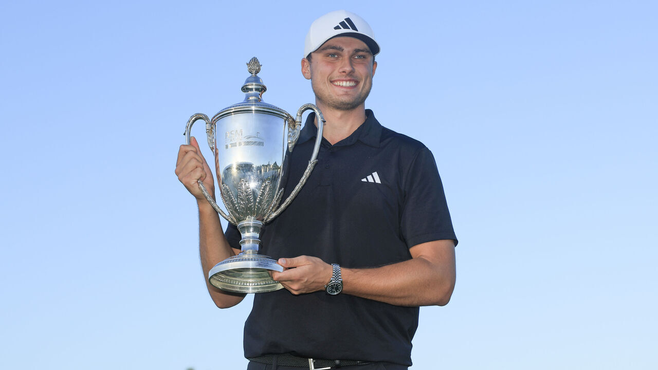 ST SIMONS ISLAND, GEORGIA - NOVEMBER 19: Ludvig Aberg of Sweden poses for a photo with the trophy after winning The RSM Classic on the Seaside Course at Sea Island Resort on November 19, 2023 in St Simons Island, Georgia.