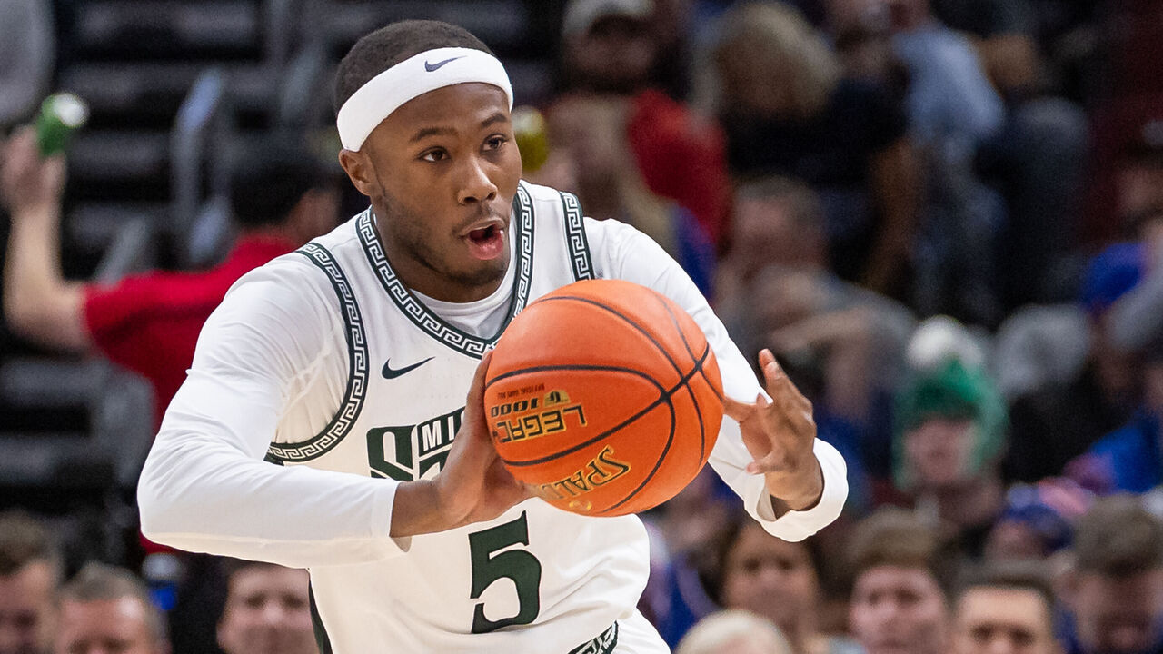 CHICAGO, ILLINOIS - NOVEMBER 14: Tre Holloman #5 of the Michigan State Spartans brings the ball up court against the Duke Blue Devils in the Champions Classic at the United Center on November 14, 2023 in Chicago, Illinois.