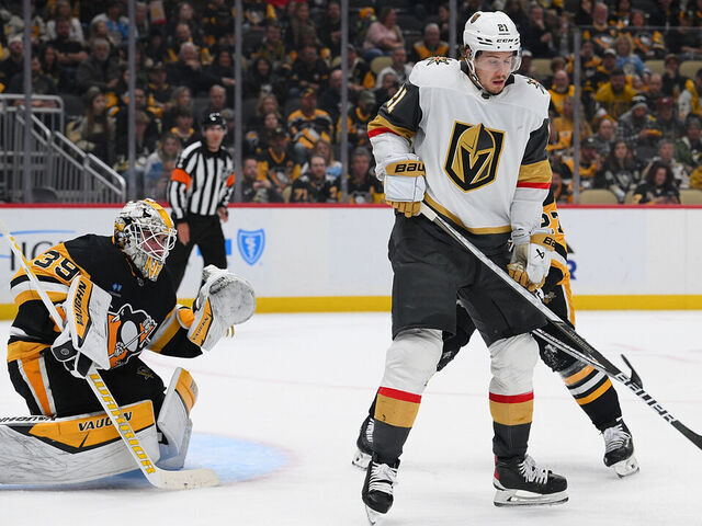 PITTSBURGH, PENNSYLVANIA - NOVEMBER 19: Brett Howden #21 of the Vegas Golden Knights tries to screen goaltender Alex Nedeljkovic #39 of the Pittsburgh Penguins in the second period during the game at PPG PAINTS Arena on November 19, 2023 in Pittsburgh, Pennsylvania.