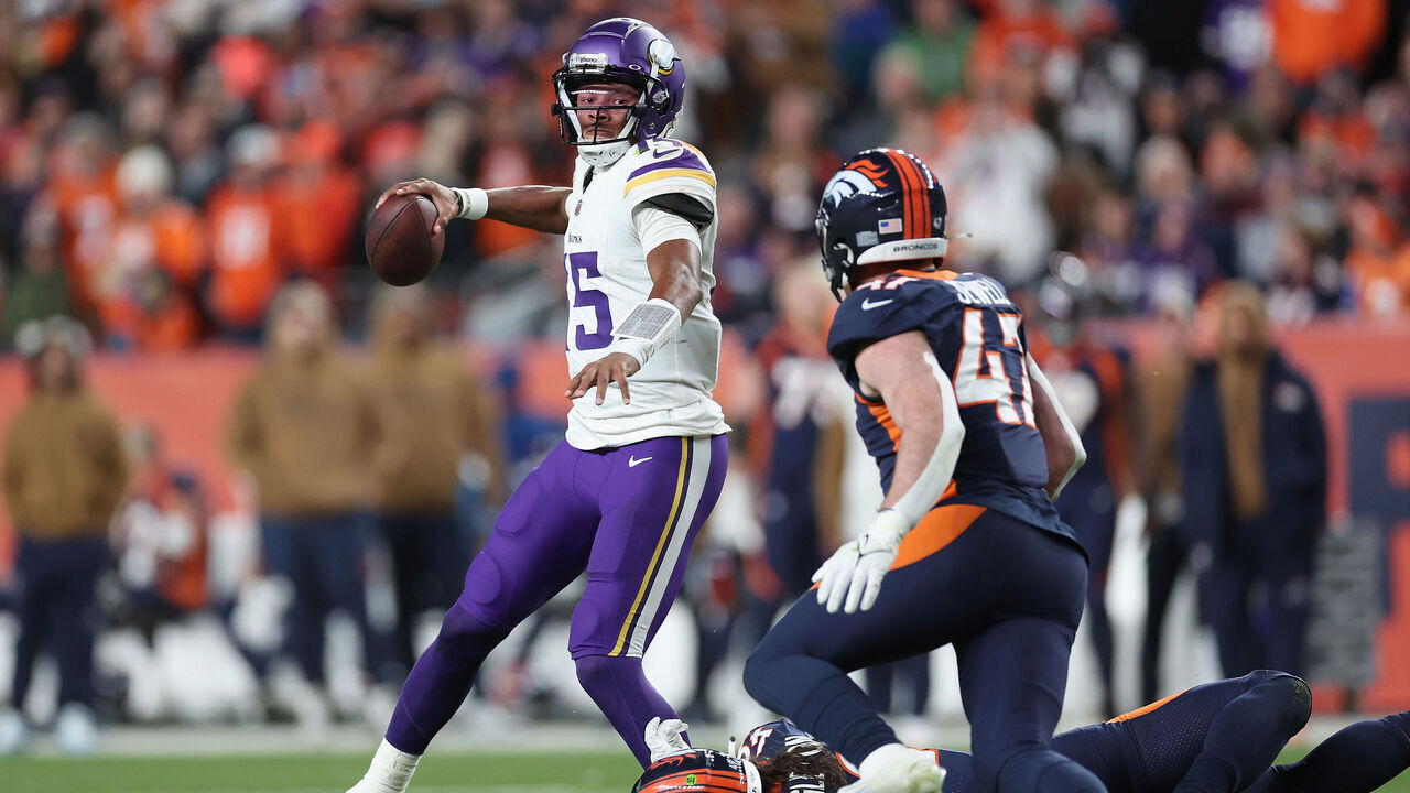 DENVER, COLORADO - NOVEMBER 19: Quarterback Joshua Dobbs #15 of the Minnesota Vikings looks to pass under pressure during the fourth quarter of the NFL game against the Denver Broncos at Empower Field At Mile High on November 19, 2023 in Denver, Colorado. The Broncos defeated the Vikings 21-20.