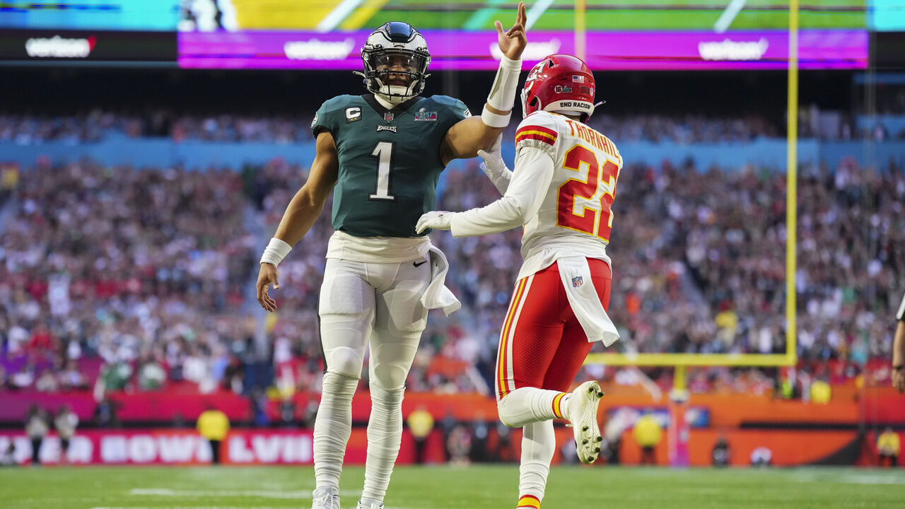 GLENDALE, AZ - FEBRUARY 12: Jalen Hurts #1 of the Philadelphia Eagles celebrates against Juan Thornhill #22 of the Kansas City Chiefs after Super Bowl LVII at State Farm Stadium on February 12, 2023 in Glendale, Arizona. The Chiefs defeated the Eagles 38-35.