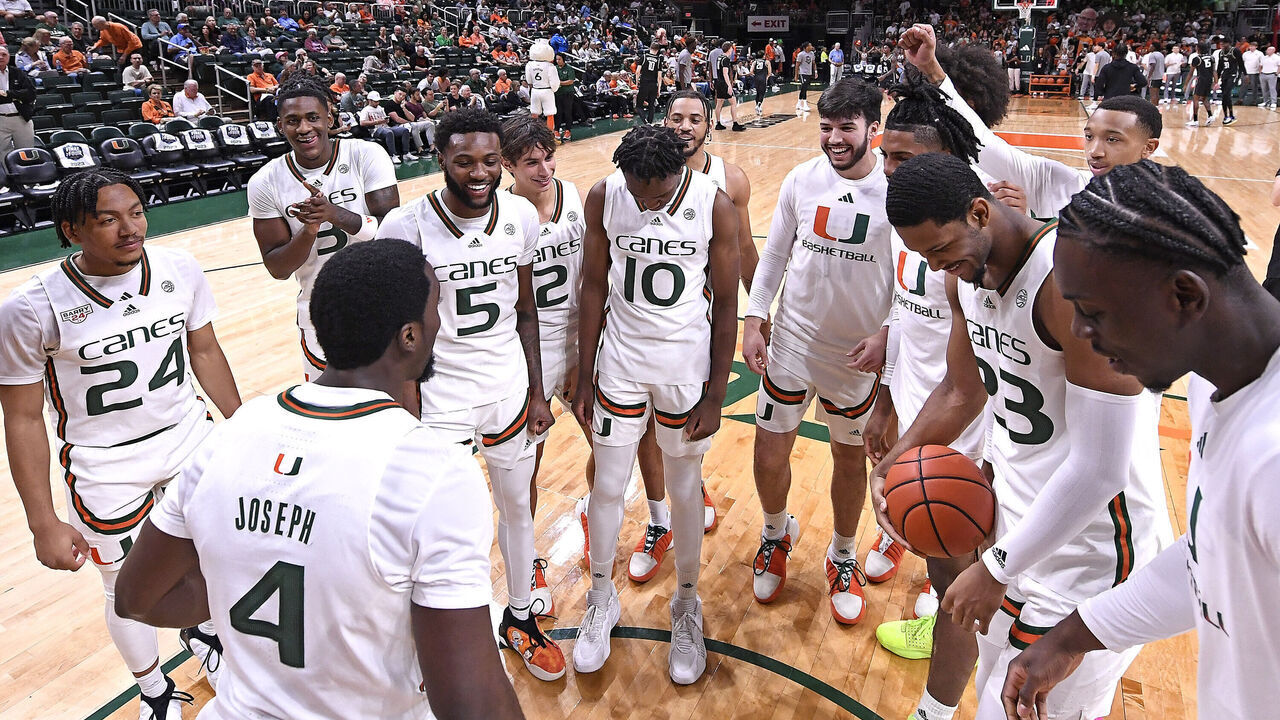 CORAL GABLES, FL - NOVEMBER 10: Miami's team (pictured, guard Bensley Joseph (4), guard Nijel Pack (24), guard Wooga Poplar (5), guard Christian Watson (3), guard Paul Djobet (10), guard Carson Mastin (2), forward AJ Casey (23), center Michael Nwoko (1), guard Matthew Cleveland (0)) gather on the court prior to the game as the Miami Hurricanes faced the UCF Knights on November 10, 2023, at the Watsco Center in Coral Gables, Florida.