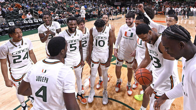 CORAL GABLES, FL - NOVEMBER 10: Miami's team (pictured, guard Bensley Joseph (4), guard Nijel Pack (24), guard Wooga Poplar (5), guard Christian Watson (3), guard Paul Djobet (10), guard Carson Mastin (2), forward AJ Casey (23), center Michael Nwoko (1), guard Matthew Cleveland (0)) gather on the court prior to the game as the Miami Hurricanes faced the UCF Knights on November 10, 2023, at the Watsco Center in Coral Gables, Florida.