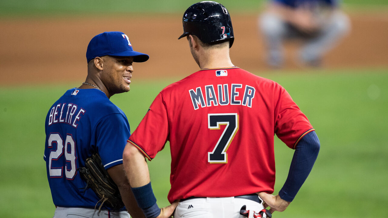 MINNEAPOLIS, MN- AUGUST 4: Joe Mauer #7 of the Minnesota Twins talks with Adrian Beltre #29 of the Texas Rangers on August 4, 2017 at Target Field in Minneapolis, Minnesota. The Twins defeated the Rangers 8-4.