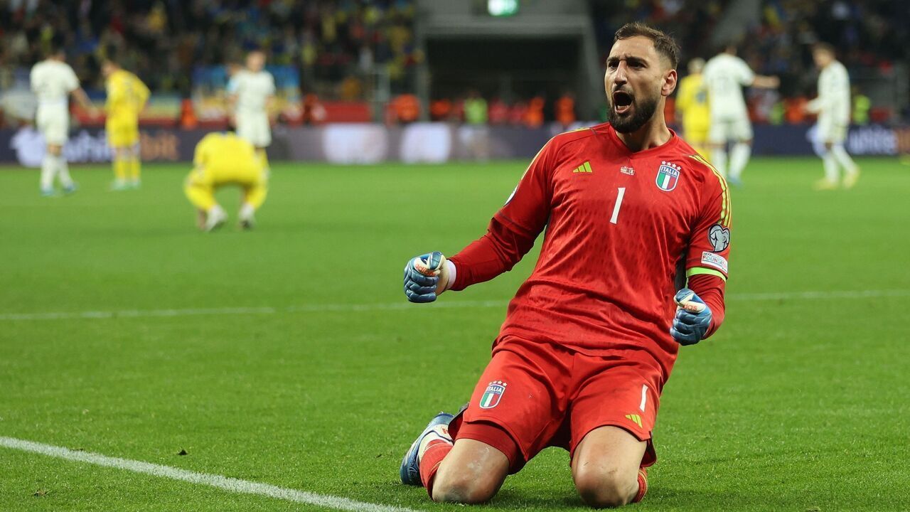 Italy's goalkeeper #01 Gianluigi Donnarumma celebrates at the final whistle of the UEFA EURO 2024 Group C qualifying football match between Ukraine and Italy at the BayArena Stadium in Leverkusen, western Germany on November 20, 2023.