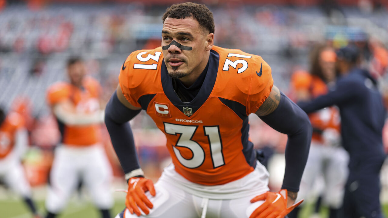 DENVER, COLORADO - OCTOBER 29: Justin Simmons #31 of the Denver Broncos stretches as he warms up prior to an NFL football game between the Denver Broncos and the Kansas City Chiefs at Empower Field At Mile High on October 29, 2023 in Denver, Colorado.