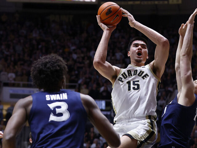WEST LAFAYETTE, IN - NOVEMBER 13: Purdue Boilermakers center Zach Edey (15) goes up with his shot over Xavier Musketeers forward Sasa Ciani (21) in the fist half of play during a mens college basketball game between the Xavier Musketeers and the Purdue Boilermakers on November 13, 2023 at Mackey Arena in West Lafayette, IN.