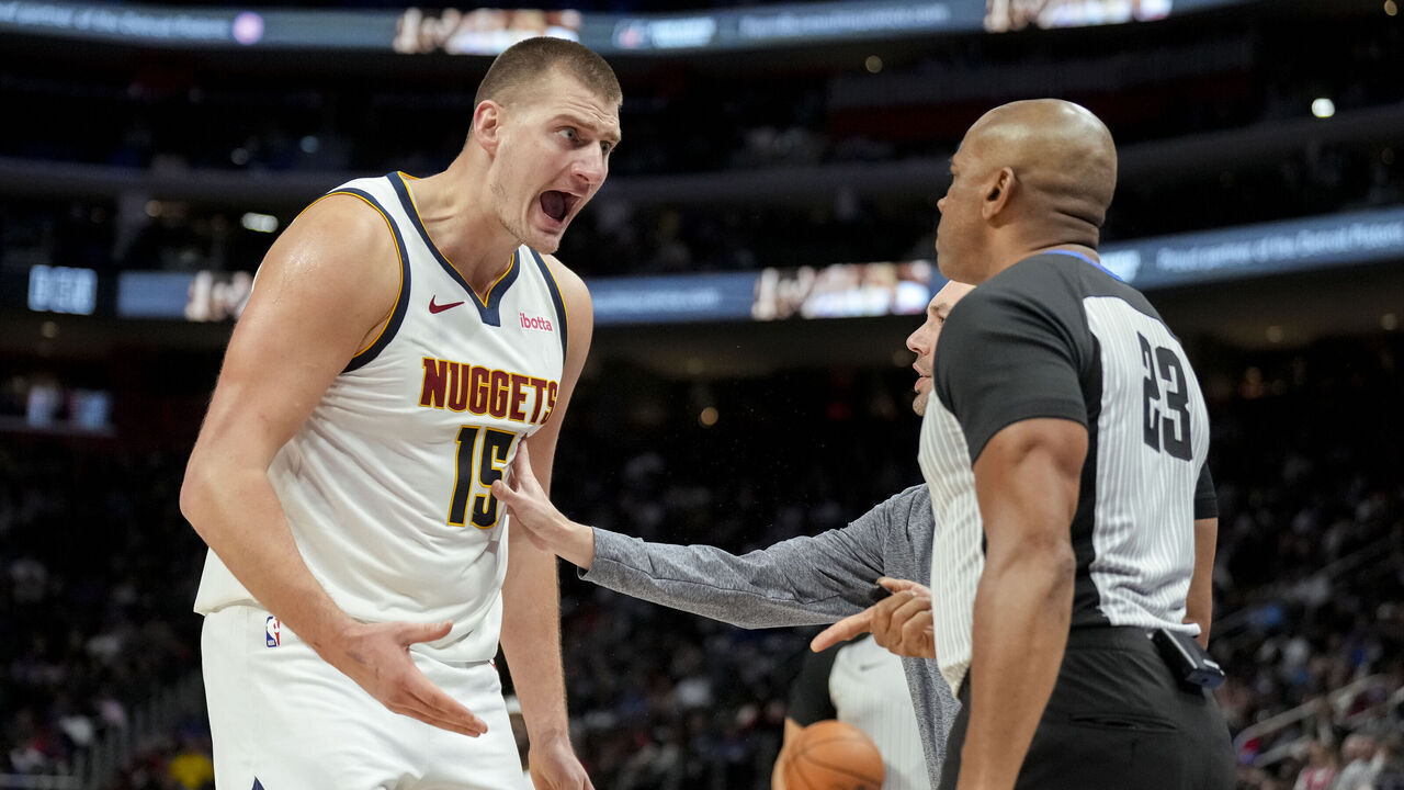 DETROIT, MICHIGAN - NOVEMBER 20: Nikola Jokic #15 of the Denver Nuggets reacts against referee Tre Maddox #23 and is ejected during the second quarter against the Detroit Pistonsat Little Caesars Arena on November 20, 2023 in Detroit, Michigan.