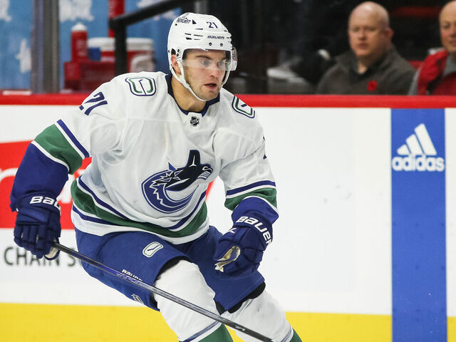 OTTAWA, CANADA - NOVEMBER 09: Nils Hoglander #21 of the Vancouver Canucks skates against the Ottawa Senators at Canadian Tire Centre on November 09, 2023 in Ottawa, Ontario, Canada.