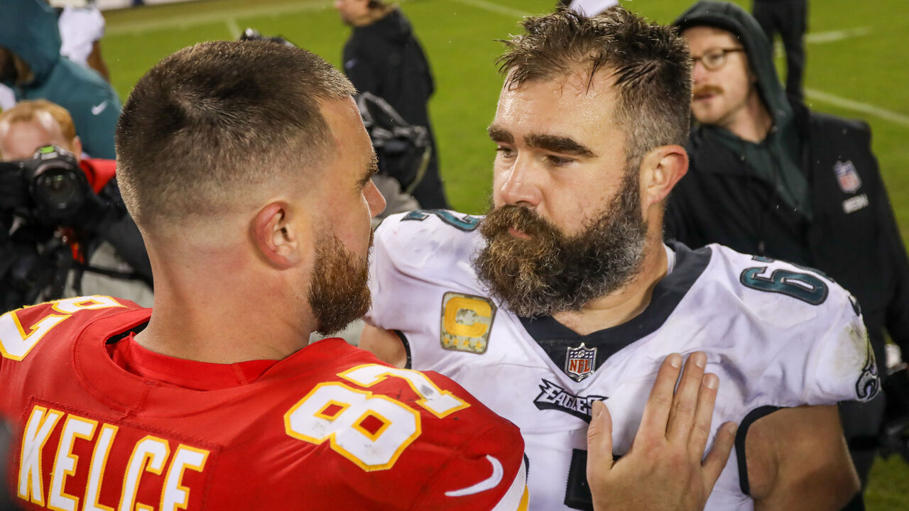 KANSAS CITY, MO - NOVEMBER 20: Philadelphia Eagles center Jason Kelce (62) and Kansas City Chiefs tight end Travis Kelce (87) hug after an NFL football game between the Philadelphia Eagles and Kansas City Chiefs on Nov 20, 2023 at GEHA Field at Arrowhead Stadium in Kansas City, MO.