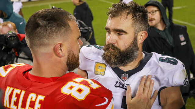KANSAS CITY, MO - NOVEMBER 20: Philadelphia Eagles center Jason Kelce (62) and Kansas City Chiefs tight end Travis Kelce (87) hug after an NFL football game between the Philadelphia Eagles and Kansas City Chiefs on Nov 20, 2023 at GEHA Field at Arrowhead Stadium in Kansas City, MO.