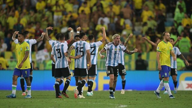 Argentina's midfielder Rodrigo De Paul (2-R) and teammates celebrate their victory at the end of the 2026 FIFA World Cup South American qualification football match between Brazil and Argentina at Maracana Stadium in Rio de Janeiro, Brazil, on November 21, 2023.