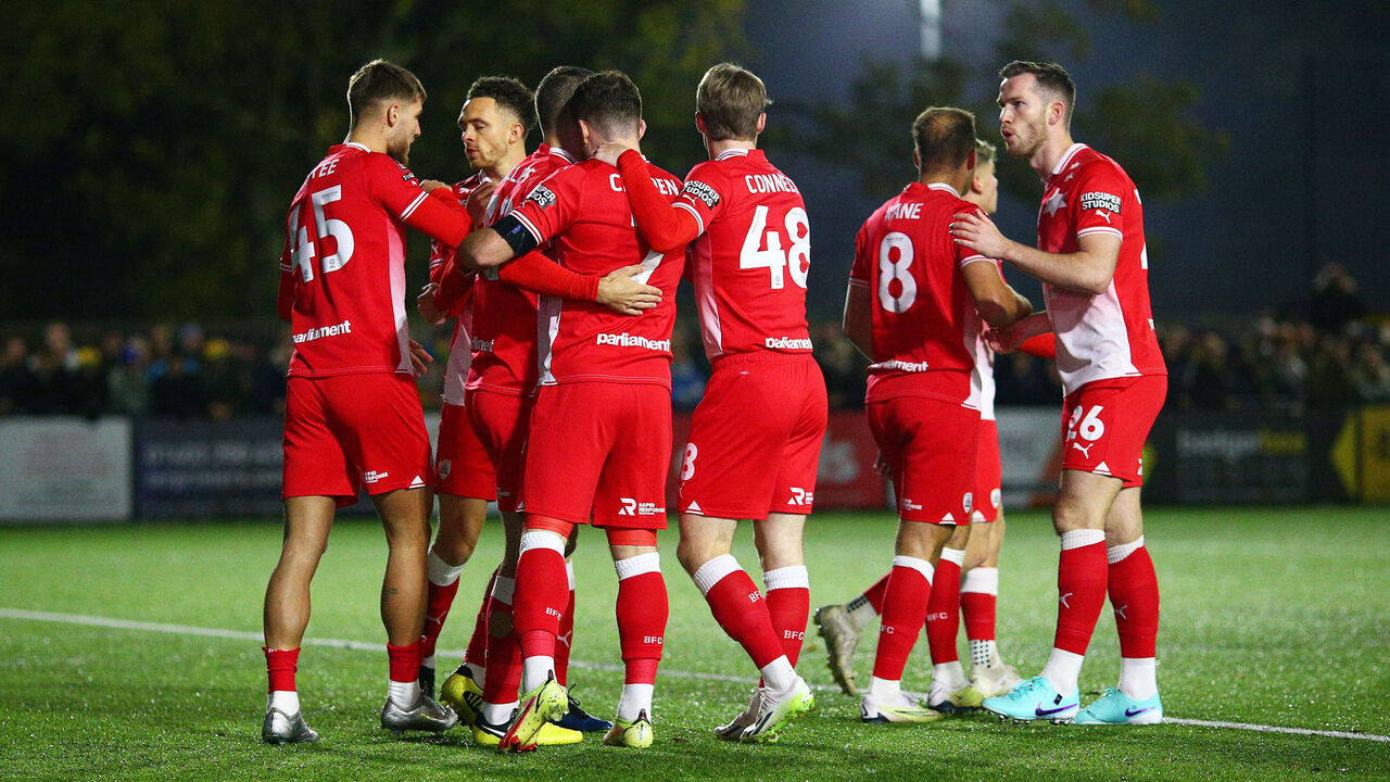 HORSHAM, ENGLAND - NOVEMBER 14: Nicky Cadden of Barnsley (obscured) celebrates with teammates after scoring the team's first goal during the Emirates FA Cup First Round Replay match between Horsham and Barnsley at The Camping World Community Stadium on November 14, 2023 in Horsham, England.