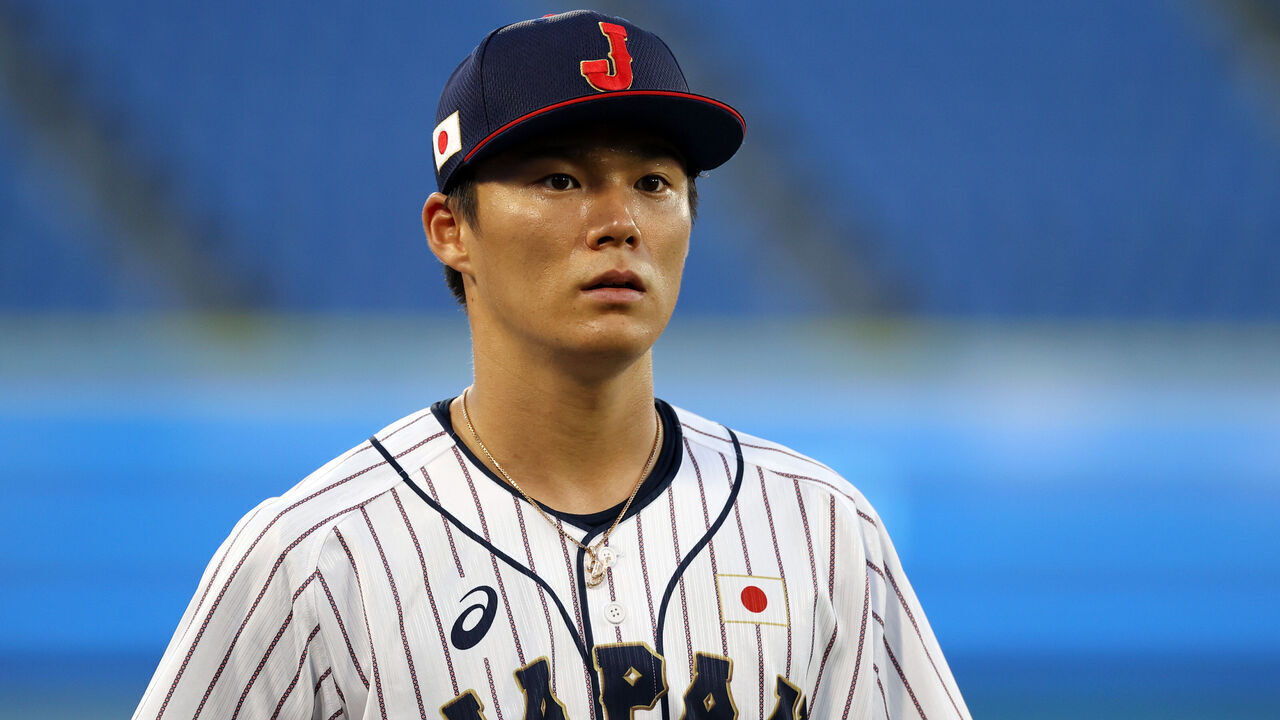 YOKOHAMA, JAPAN - AUGUST 04: Yoshinobu Yamamoto #17 of Team Japan looks on before the game against Team Republic of Korea during the semifinals of men's baseball on day twelve of the Tokyo 2020 Olympic Games at Yokohama Baseball Stadium on August 04, 2021 in Yokohama, Japan.