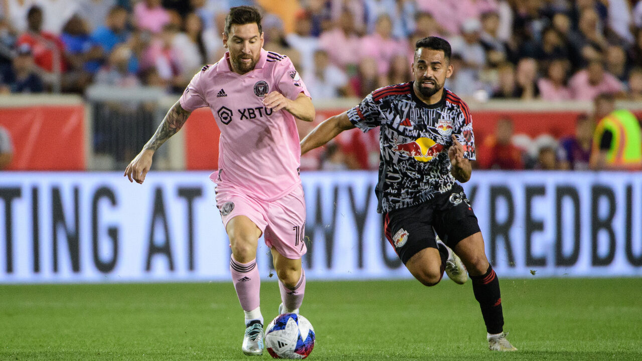 HARRISON, NJ - AUGUST 26: Lionel Messi #10 of Inter Miami CF is chased by Luquinhas #82 of the New York Red Bulls during a game between Inter Miami CF and New York Red Bulls at Red Bull Arena on August 26, 2023 in Harrison, New Jersey. .