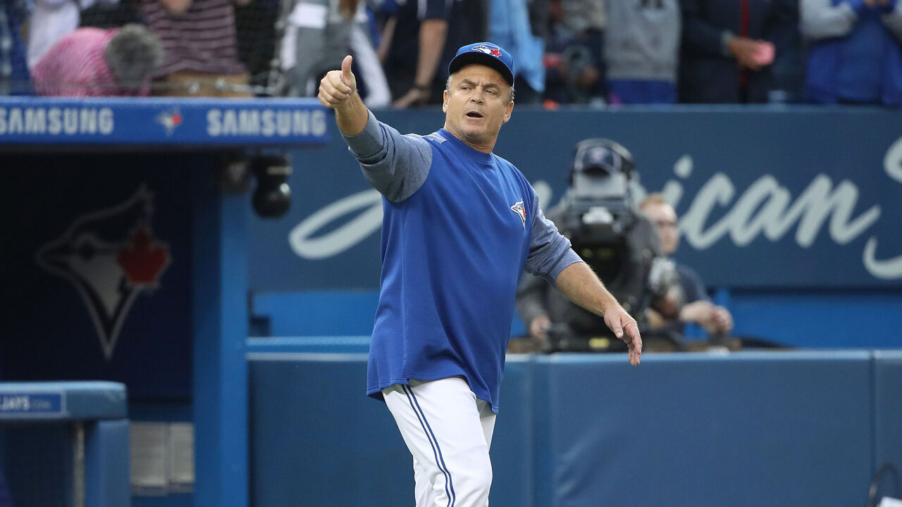 TORONTO, ON - SEPTEMBER 26: Manager John Gibbons #5 of the Toronto Blue Jays comes out of the dugout and gives a thumbs-up after their victory and his final home game as manager after their MLB game against the Houston Astros at Rogers Centre on September 26, 2018 in Toronto, Canada.