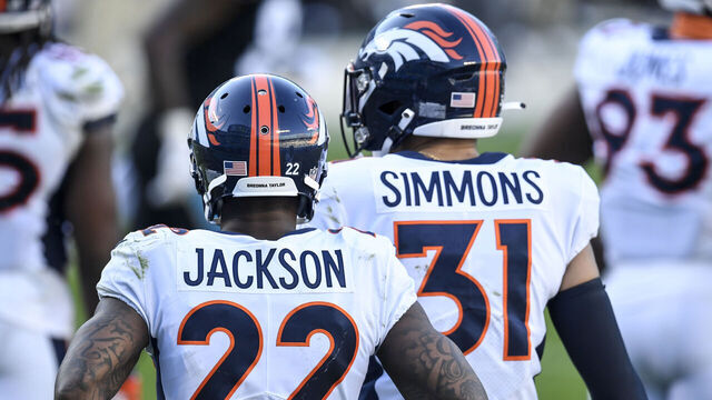 CHARLOTTE, NC - DECEMBER 13: Kareem Jackson (22) and Justin Simmons (31) lead the defense against the Carolina Panthers during the second half of Denver's 32-27 win at Bank of America Stadium on Sunday, December 13, 2020.