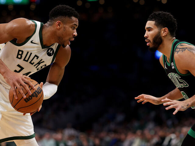 BOSTON, MASSACHUSETTS - NOVEMBER 22: Jayson Tatum #0 of the Boston Celtics defends Giannis Antetokounmpo #34 of the Milwaukee Bucks during the first quarter at TD Garden on November 22, 2023 in Boston, Massachusetts.