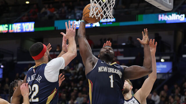 NEW ORLEANS, LOUISIANA - NOVEMBER 22: Zion Williamson #1 of the New Orleans Pelicans rebounds against Domantas Sabonis #10 of the Sacramento Kings during the second half at the Smoothie King Center on November 22, 2023 in New Orleans, Louisiana.